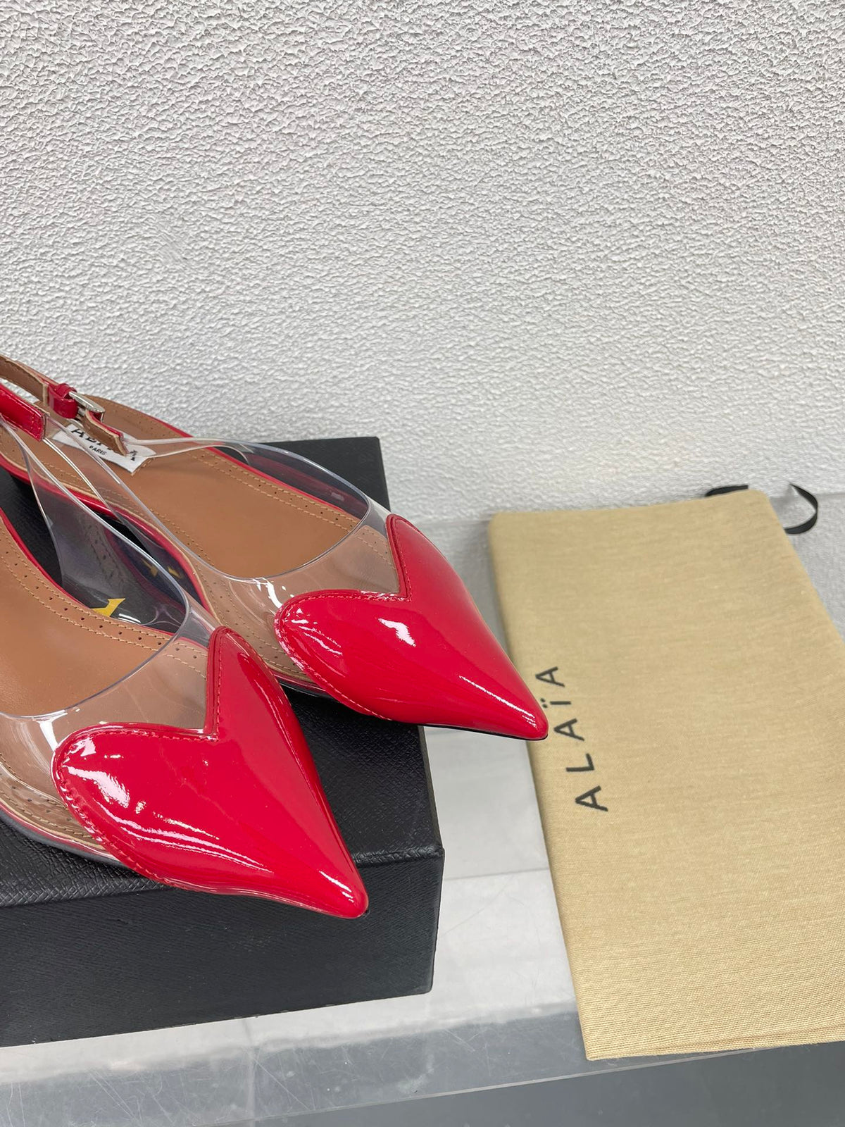 ALAIA LE COEUR FLAT SLINGBACKS IN CHERRY RED PATENT LAMBSKIN