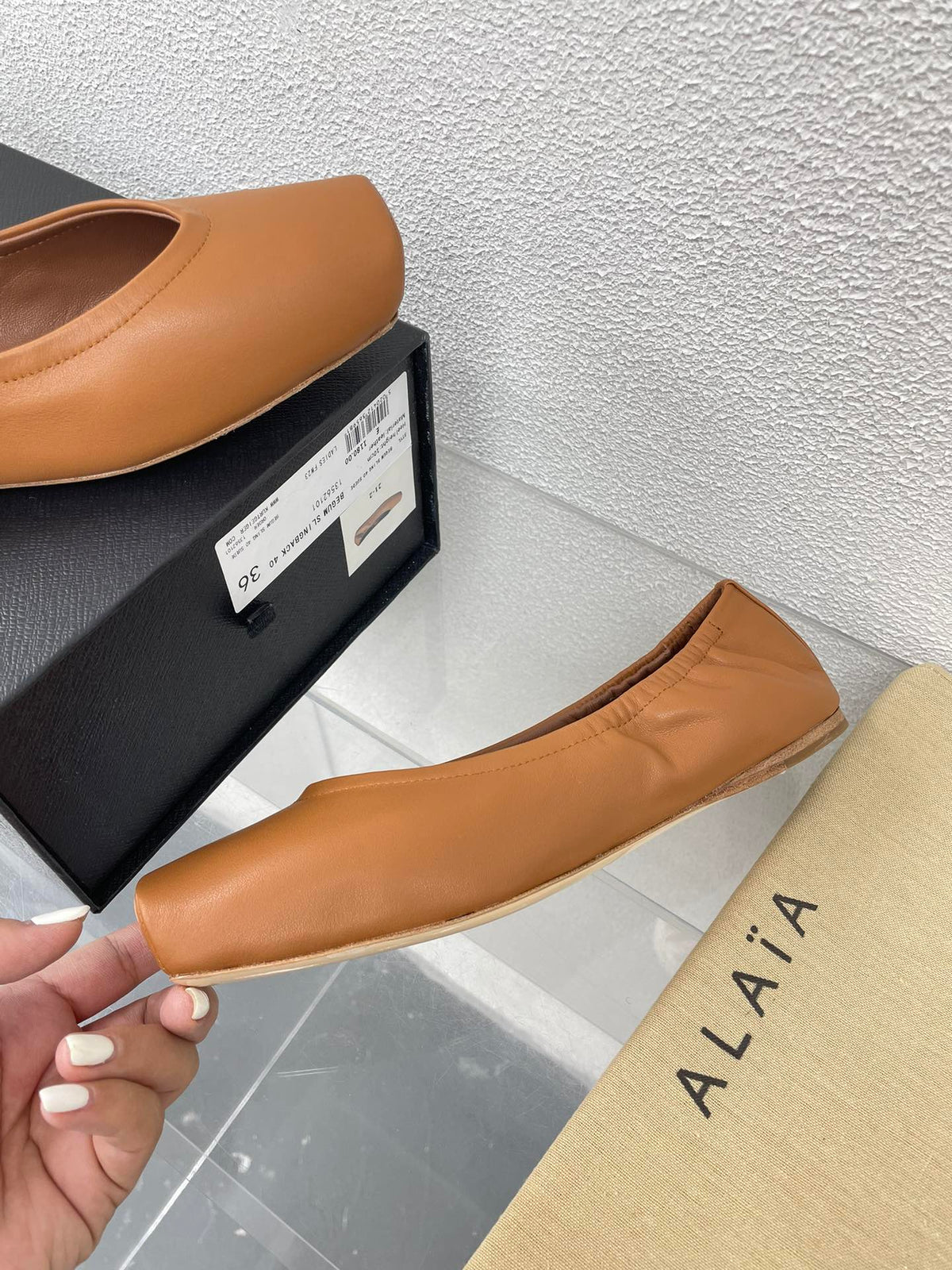 ALAIA BALLET FLATS IN COPPER BROWN CALFSKIN