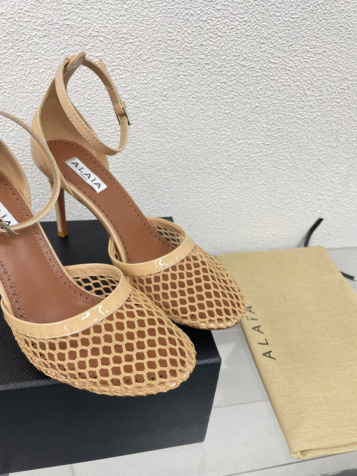ALAIA HIGH FISHNET 9 CM PUMPS IN EGG NOG MESH