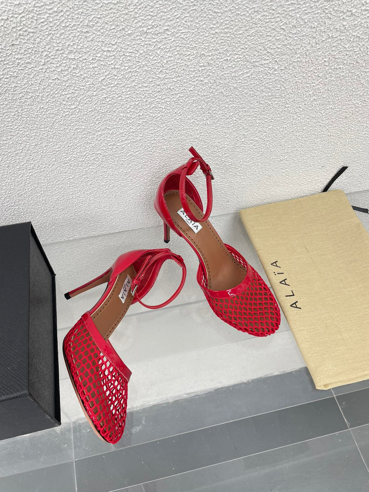 ALAIA HIGH FISHNET 9 CM PUMPS IN CHERRY RED MESH