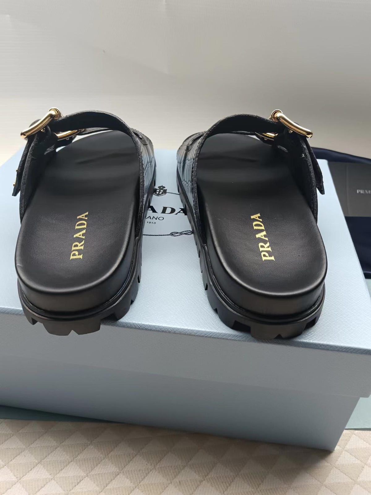 PRADA 26S STRAP SLIDES IN BLACK CROC EMBOSSED CALFSKIN GOLD HARDWARE