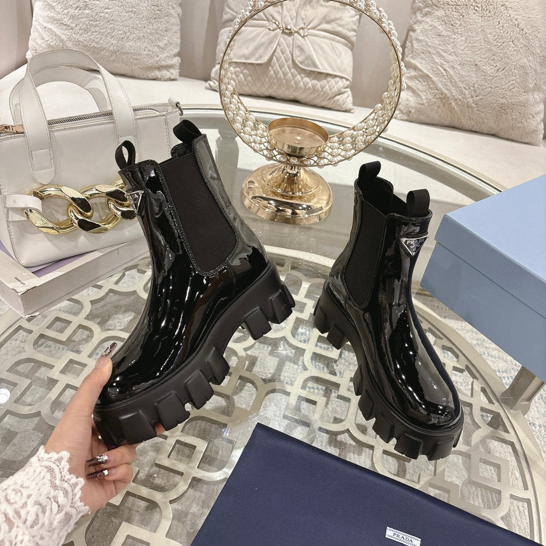 PRADA 26S MONOLITH CHELSEA BOOTS IN BLACK PATENT CALFSKIN AND FABRIC