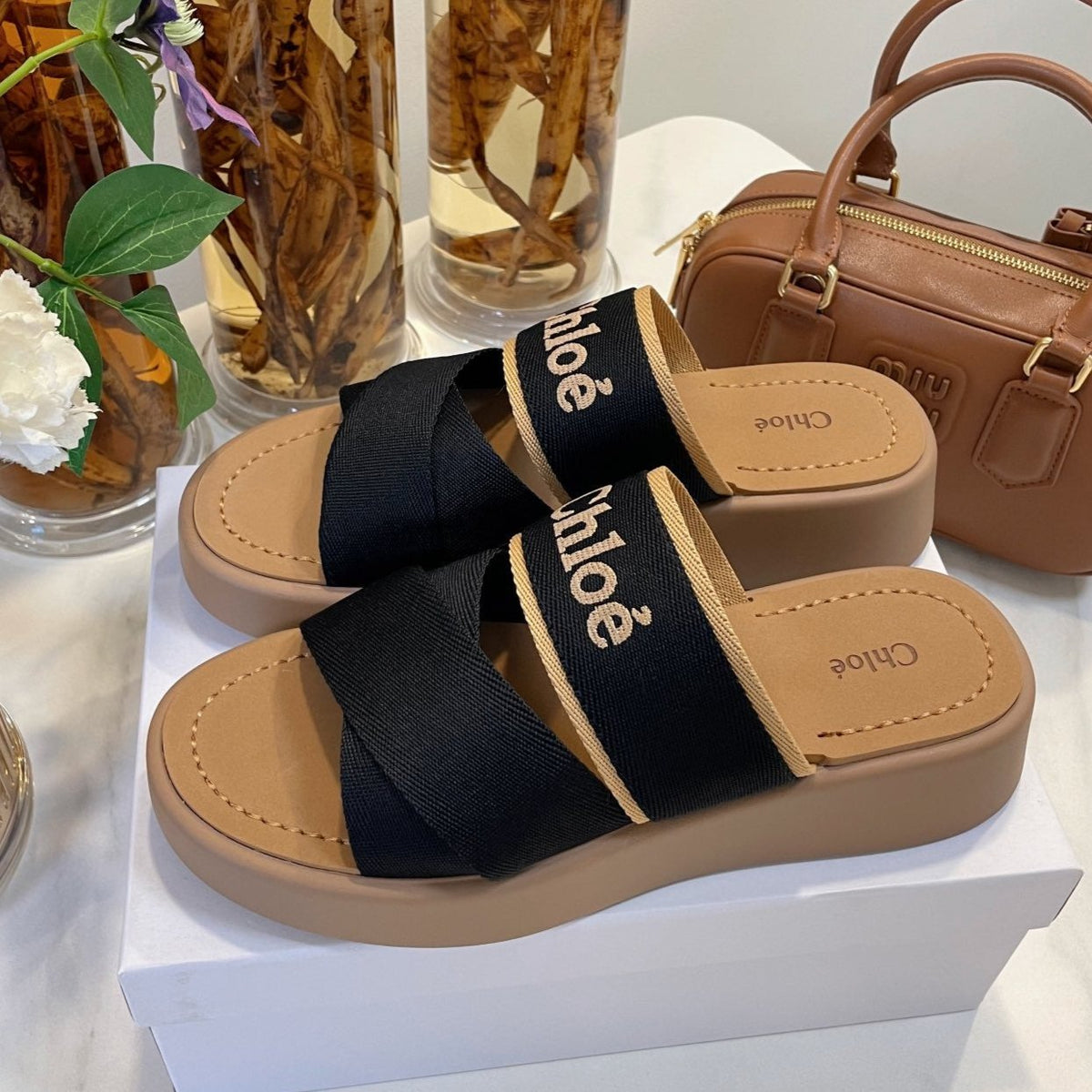 CHLOÉ WOODY WEDGE SANDALS IN BLACK CANVAS WITH CIDER BROWN RUBBER SOLE