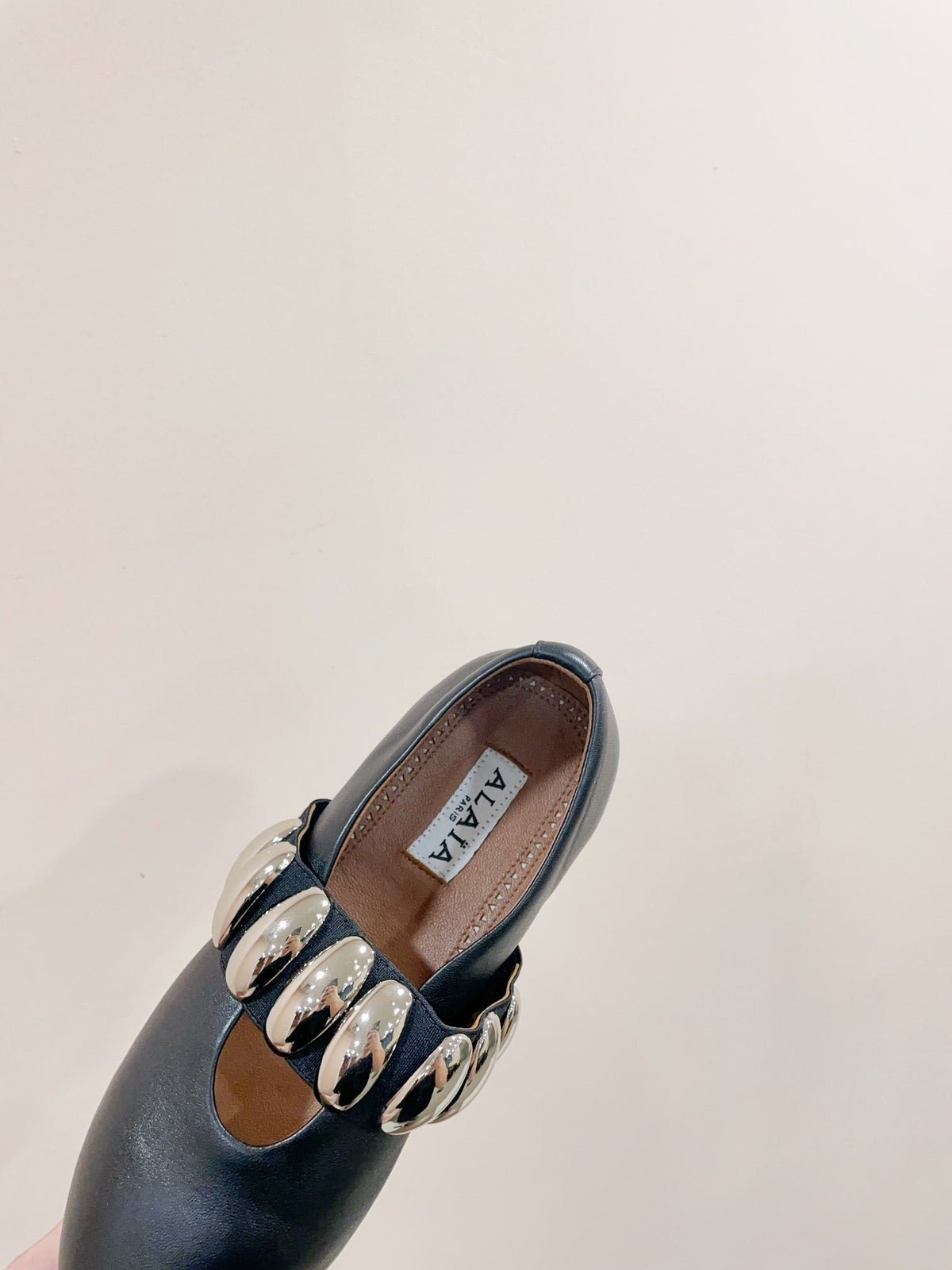 ALAIA TRIBALE BALLET FLATS IN BLACK LAMBSKIN