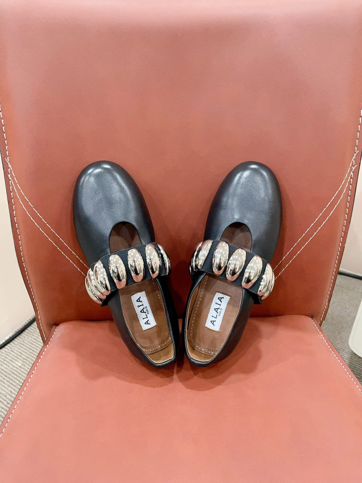 ALAIA TRIBALE BALLET FLATS IN BLACK LAMBSKIN