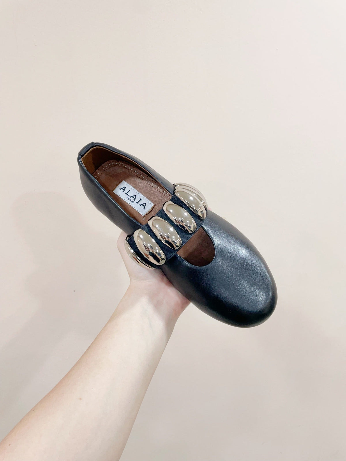 ALAIA TRIBALE BALLET FLATS IN BLACK LAMBSKIN