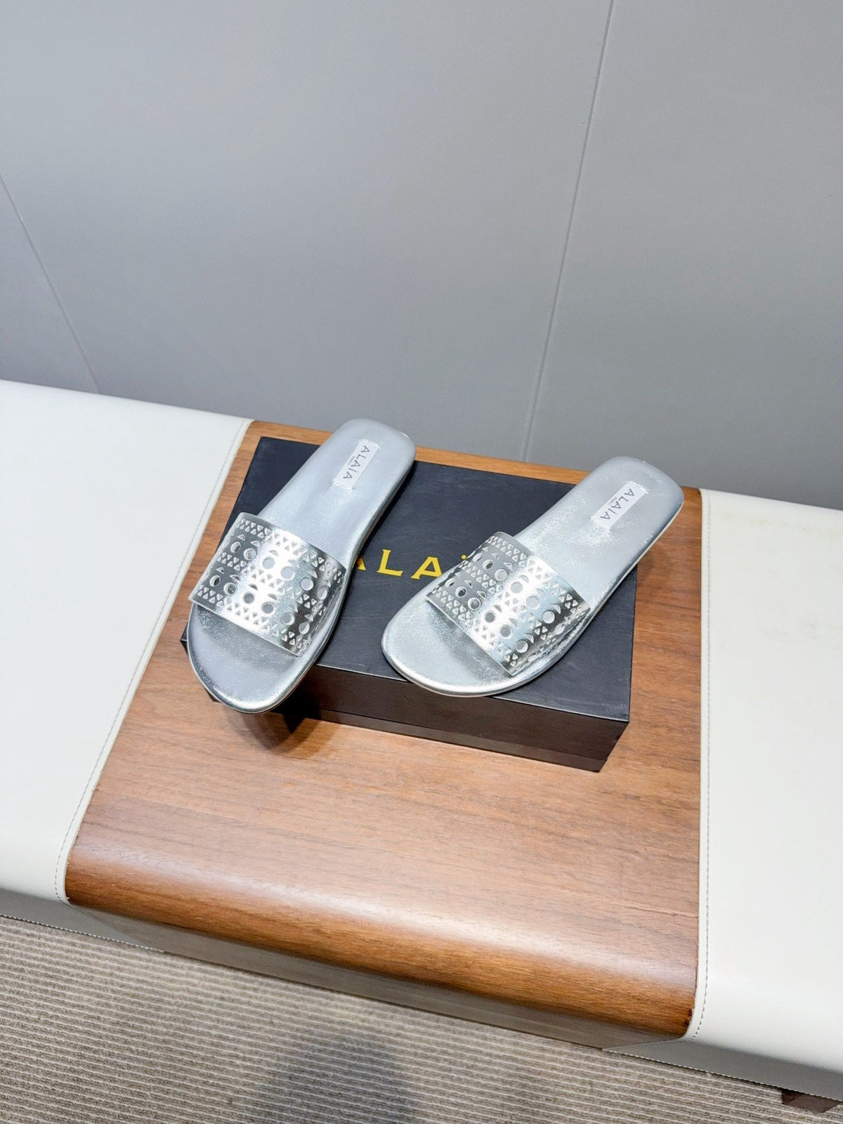 ALAIA FLAT SANDALS WITH PERFORATED STRAPS 25S IN SILVER LAMBSKIN