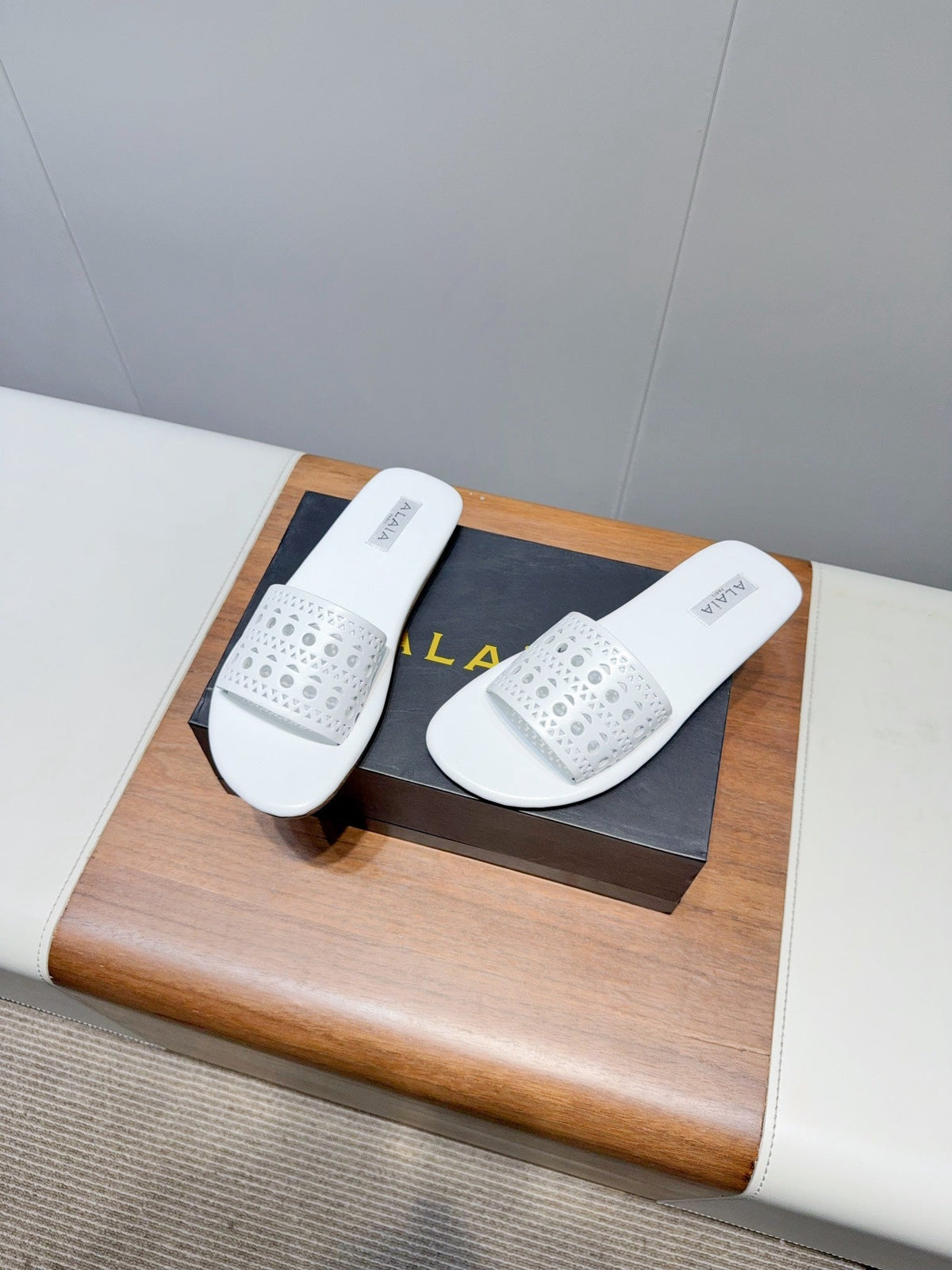 ALAIA FLAT SANDALS WITH PERFORATED STRAPS 25S IN WHITE LAMBSKIN