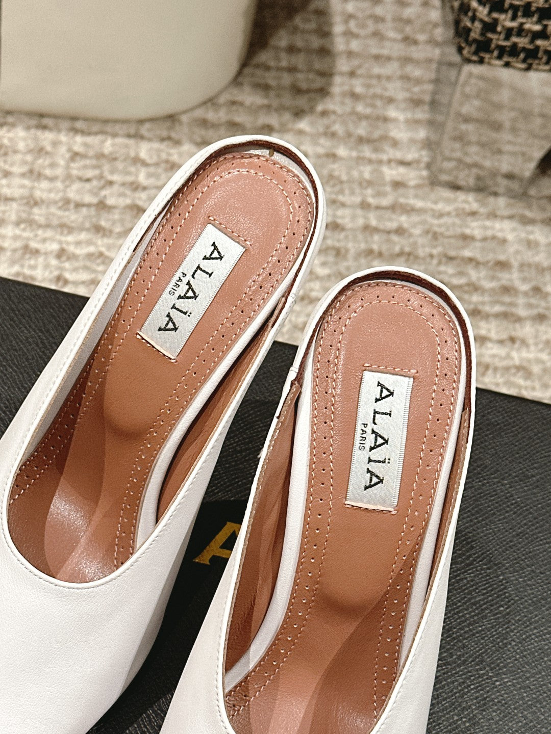 ALAIA SPIKE JEWEL MULES IN WHITE CALFSKIN