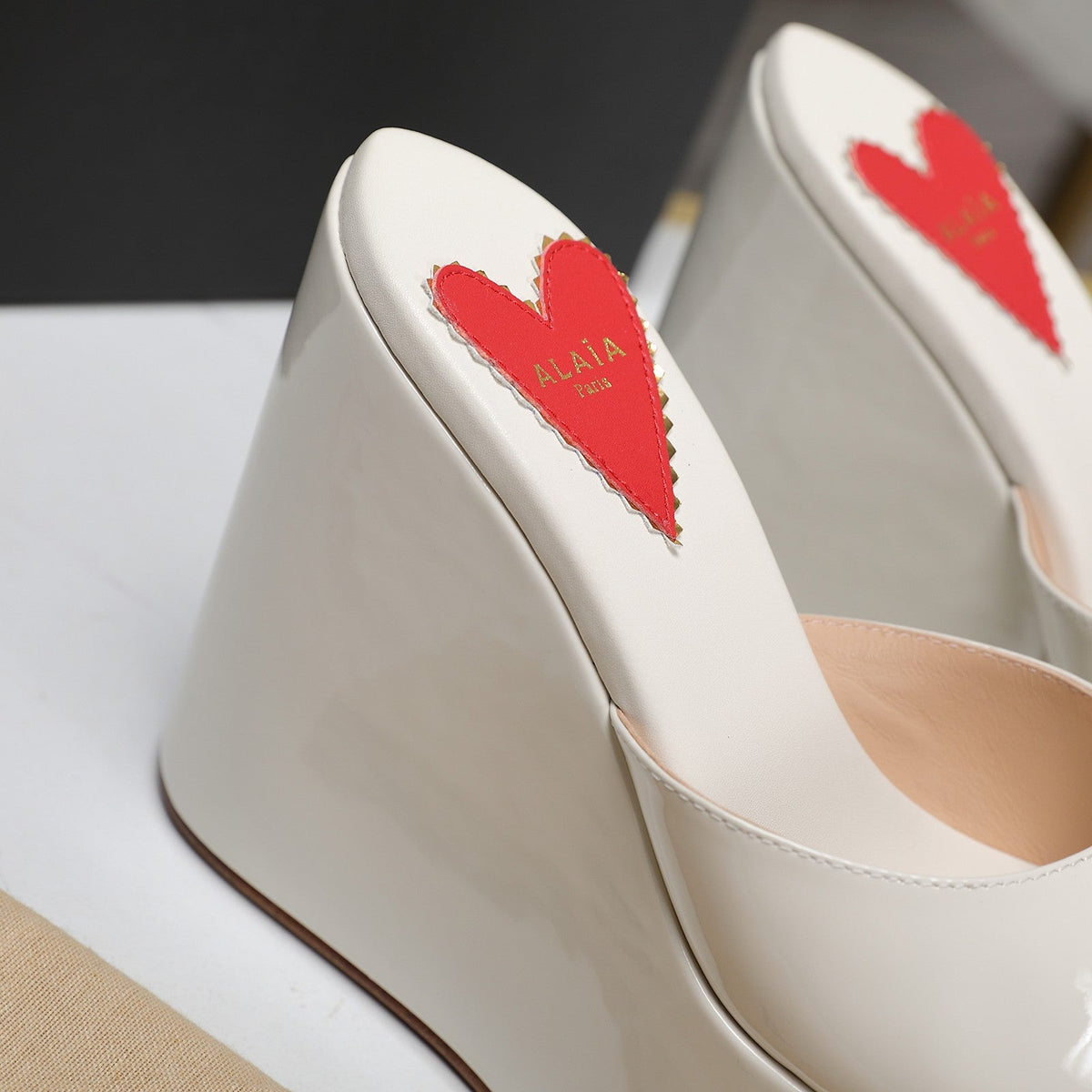 ALAIA PLATFORM WEDGE IN WHITE TAN LAMBSKIN WITH RED HEART
