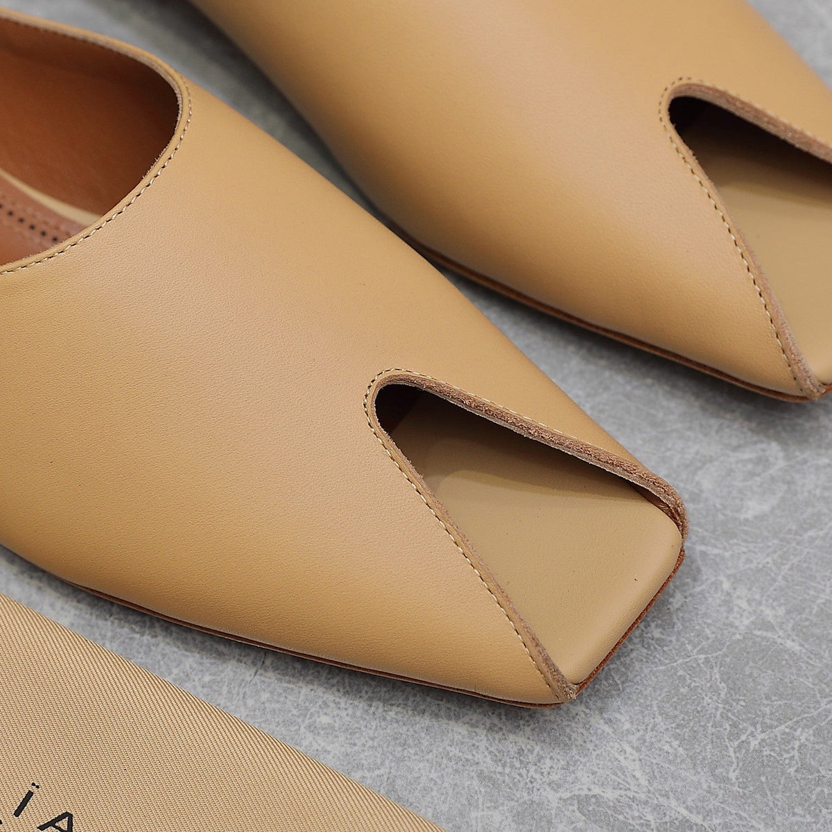 ALAIA FLAT MULE IN SEPIA TAN LAMBSKIN