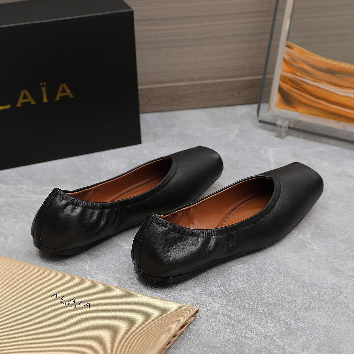 ALAIA BALLET FLATS IN BLACK SMOOTH CALFSKIN
