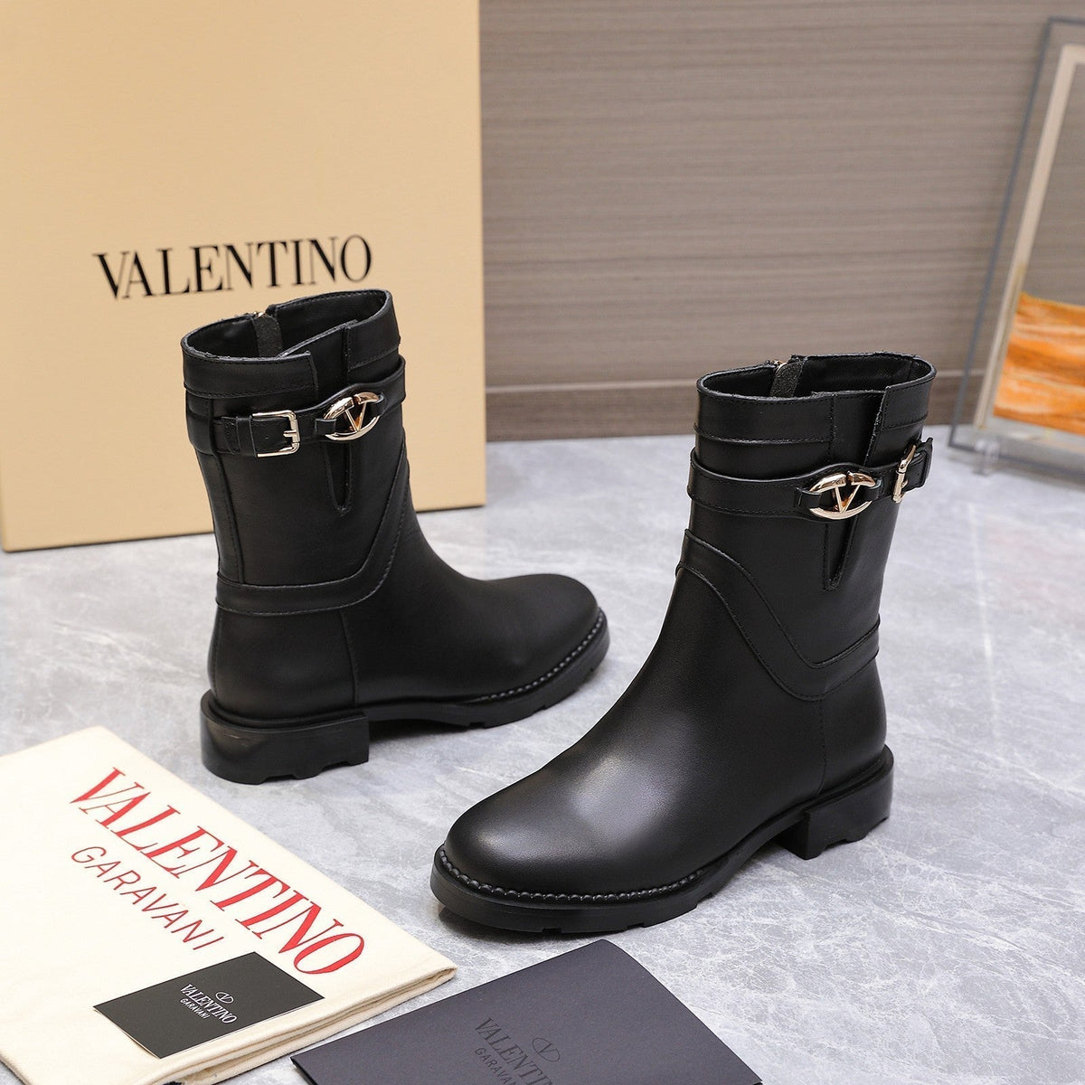 VALENTINO 25S FLAT ANKLE BOOTS IN BLACK CALFSKIN