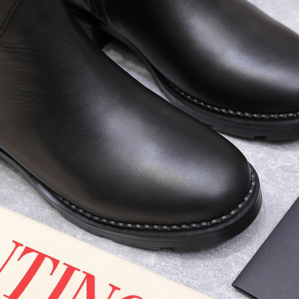 VALENTINO 25S FLAT ANKLE BOOTS IN BLACK CALFSKIN