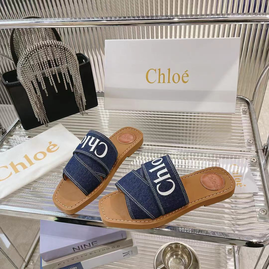 CHLOÉ WOODY MULE IN NAVY BLUE DENIM WITH WHITE LOGO