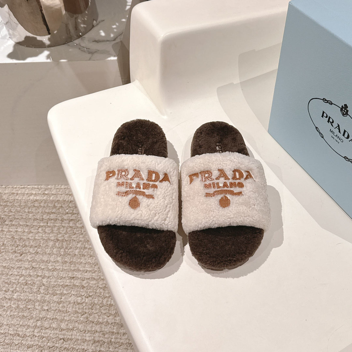 PRADA 25S FLAT MULES IN WHITE AND DARK BROWN RABBIT FUR