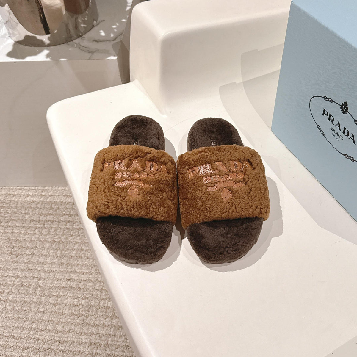 PRADA 25S FLAT MULES IN DARK BROWN RABBIT FUR