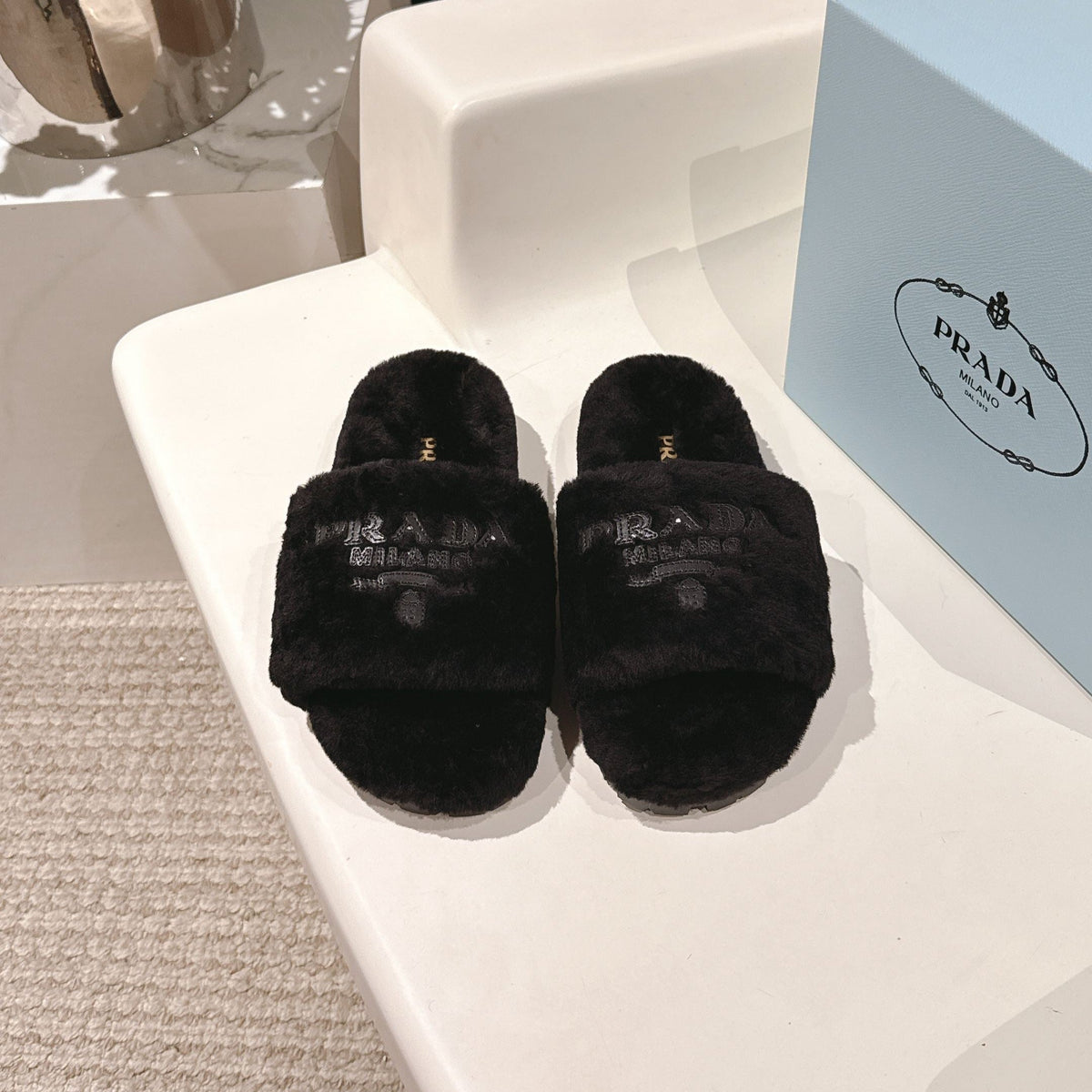 PRADA 25S FLAT MULES IN BLACK RABBIT FUR