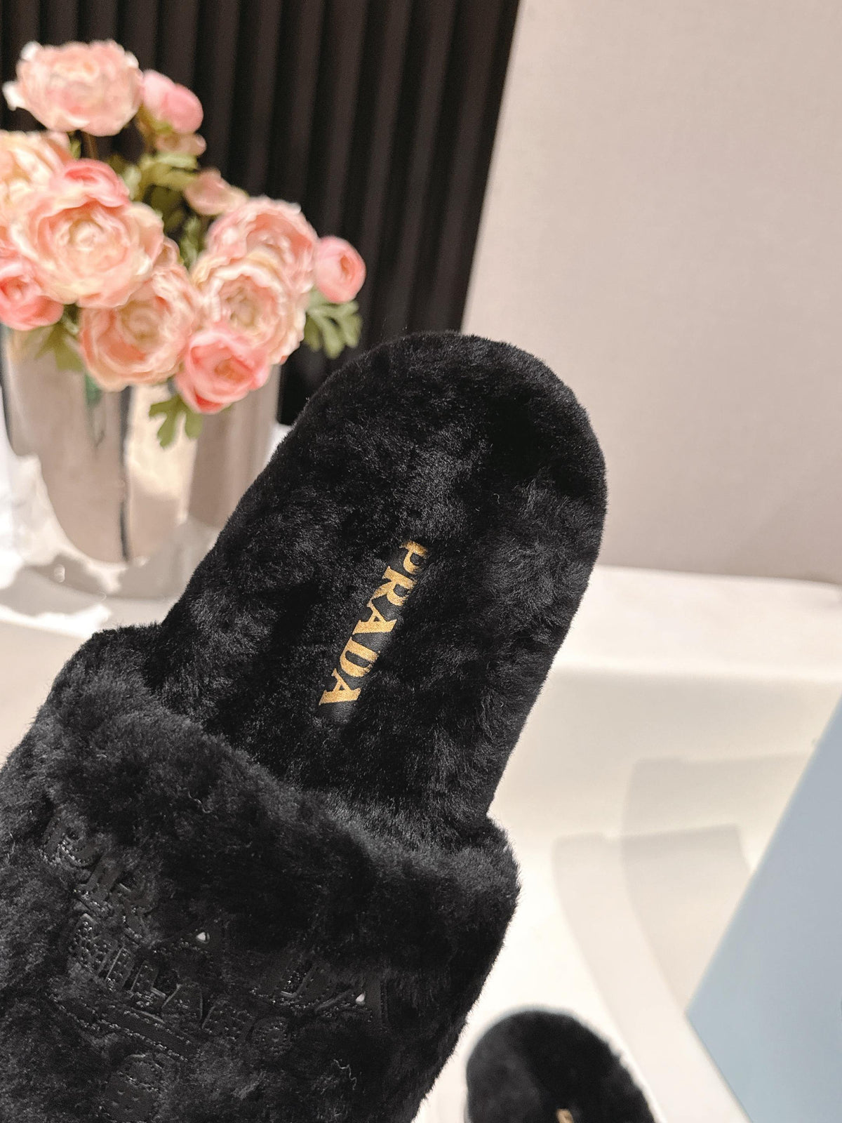 PRADA 25S FLAT MULES IN BLACK RABBIT FUR