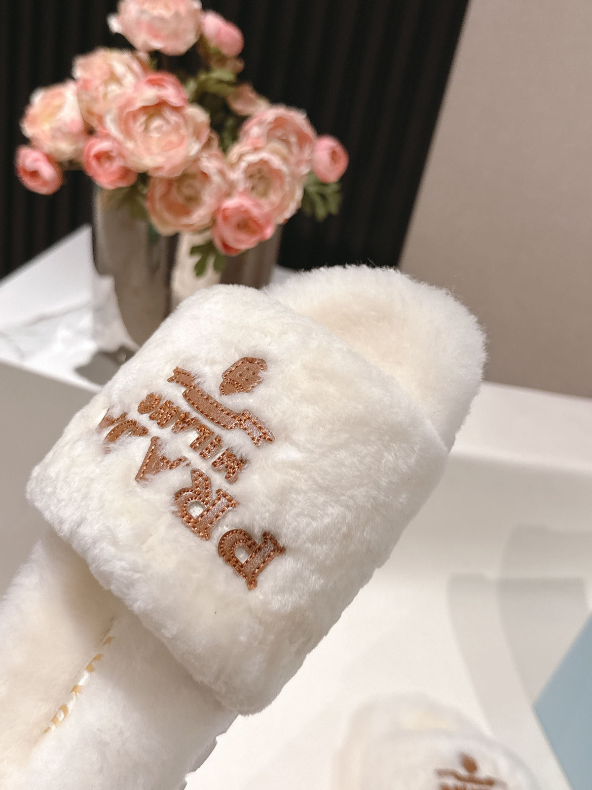 PRADA 25S FLAT MULES IN WHITE RABBIT FUR
