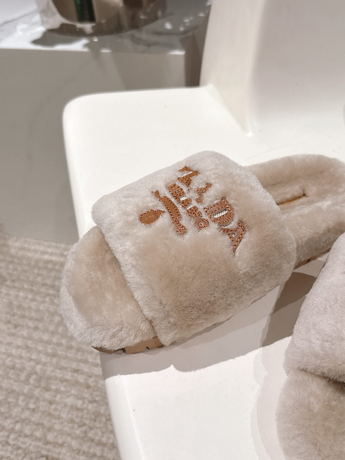 PRADA 25S FLAT MULES IN WARM TAUPE RABBIT FUR
