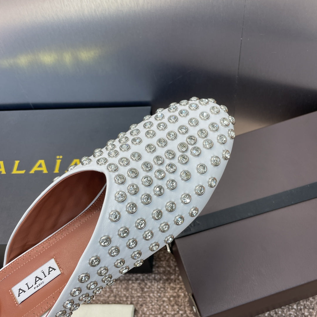ALAIA FLAT MULES 25S IN WHITE LAMBSKIN EMBELLISHED WITH CRYSTALS