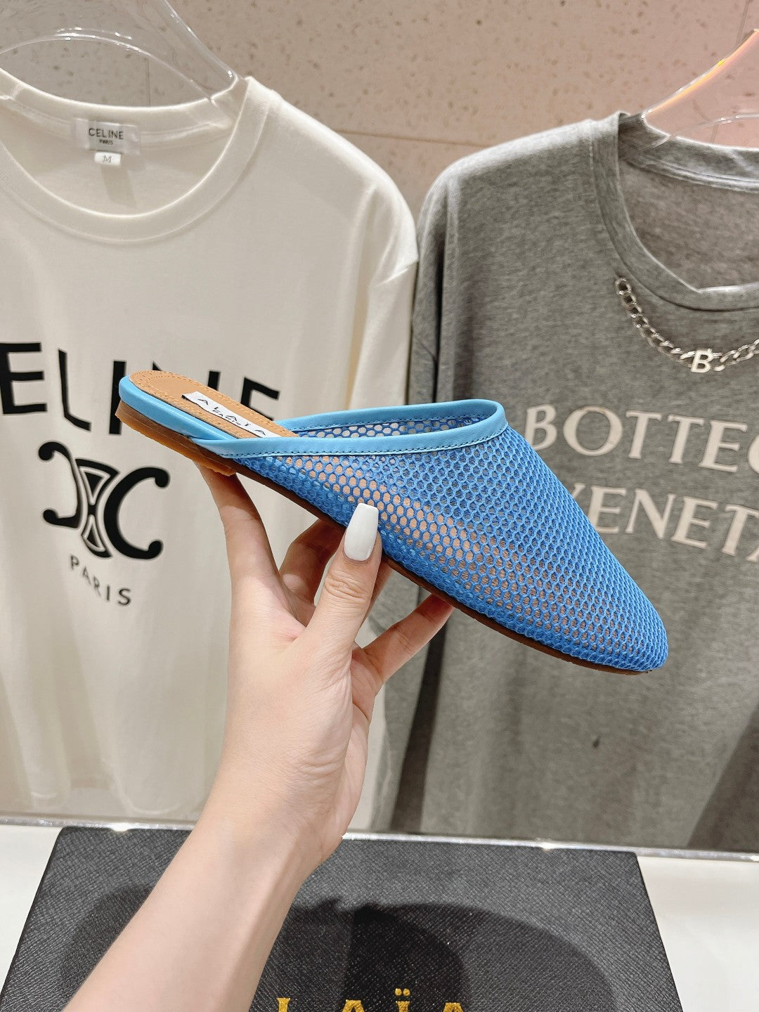 ALAIA FLAT MULES IN CERULEAN BLUE MESH FISHNET