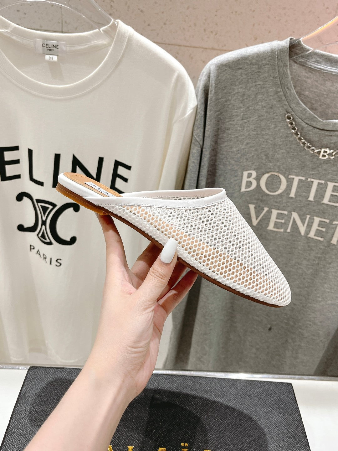 ALAIA FLAT MULES IN WHITE MESH FISHNET