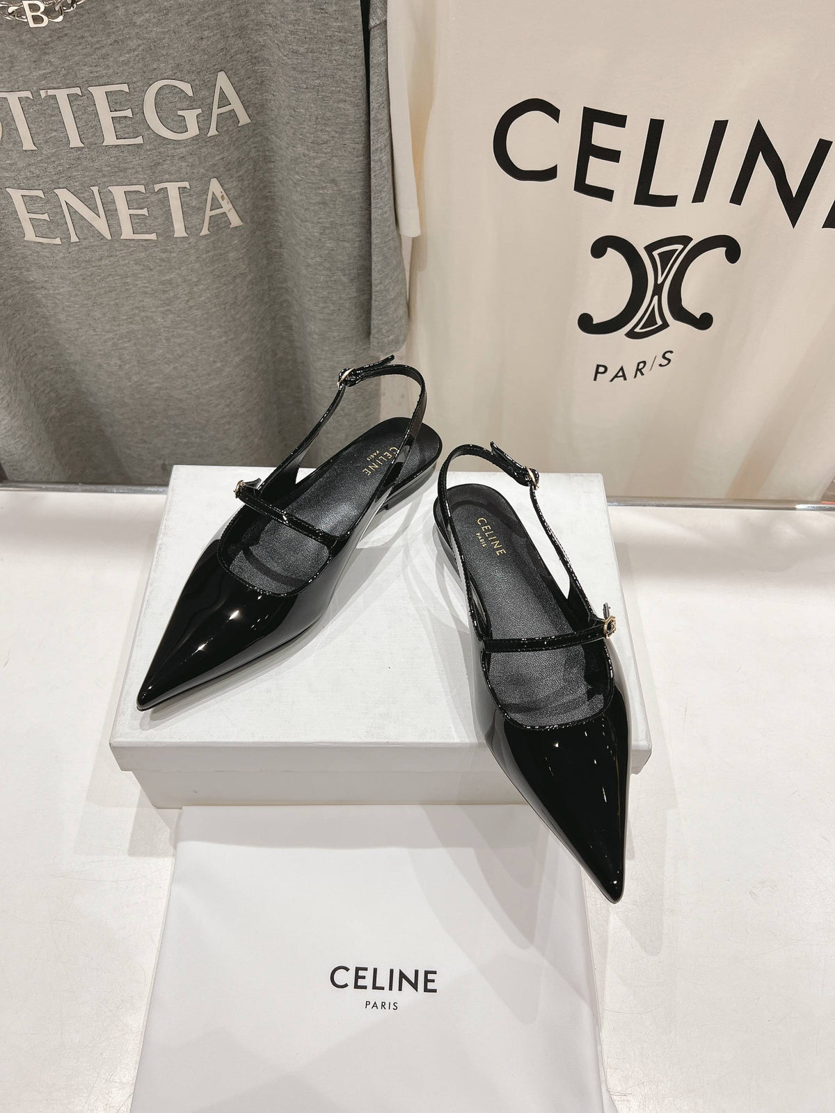 JUDY FLAT SLINGBACK IN BLACK PATENT CALFSKIN