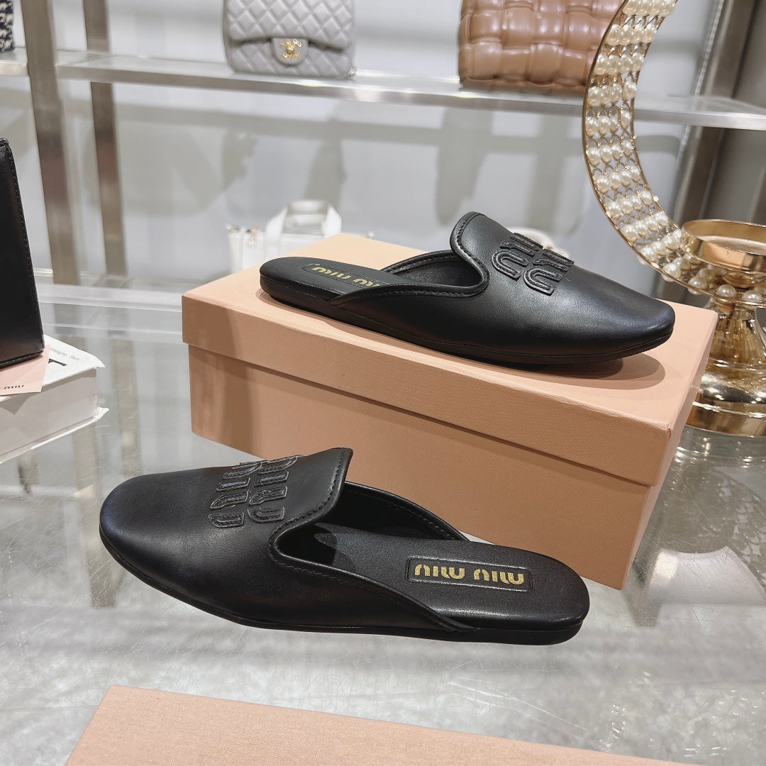 MULES SLIPPERS BLACK COWHIDE